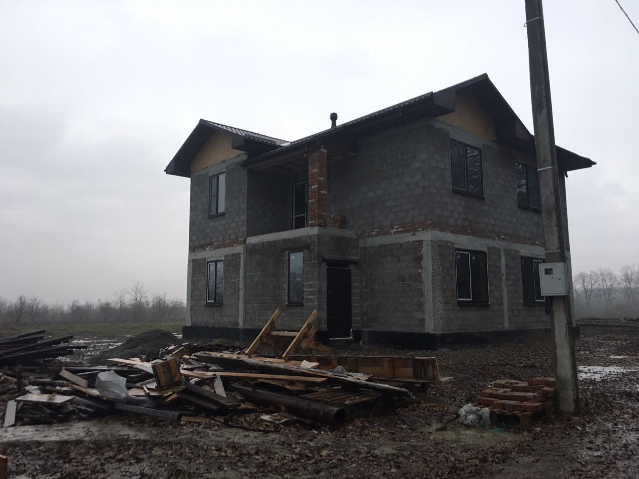 Дом из керамзитоблоков с облицовкой штукатуркой